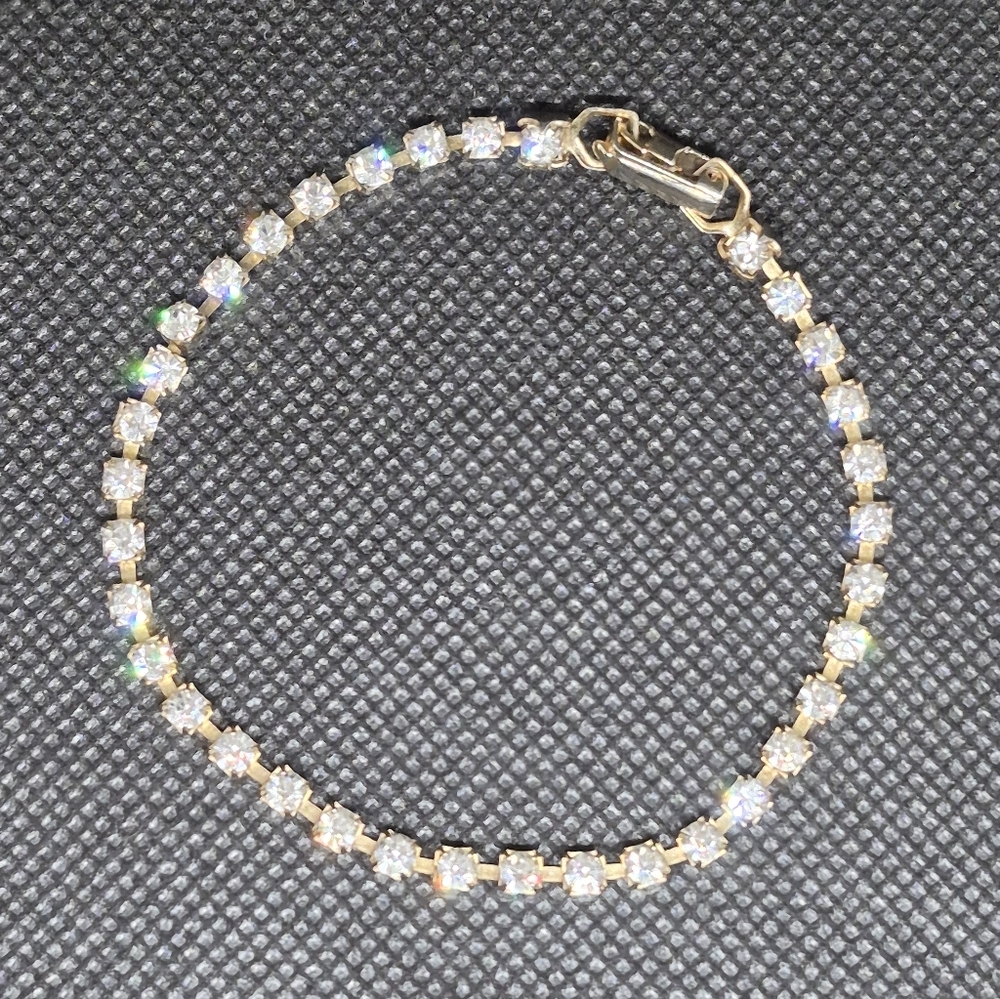 VINTAGE Clear Rhinestones in Gold Tone Setting Tennis Bracelet